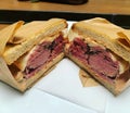 large meat sandwich, pastrami sandwich, classic sandwich with pastrami sauce and meat, large amount of pastrami, crispy bread