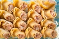 Large meat stuffed pasta on blue wooden background