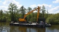 Large Mechanical Digger on Floating Pontoon