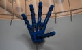 A large mechanical hand opened in a welcoming gesture. Robot exhibition with a demonstration of a large mechanical