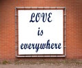 Large message written on a wall - Love is everywhere