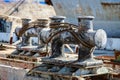 Large metal bollards with spooled steel ropes for mooring ships Royalty Free Stock Photo