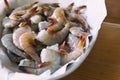 Large metal bowl lined with parchment paper filled with raw, fresh Mayport shrimp. Royalty Free Stock Photo