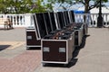 Large metal boxes with professional concert or musical equipment. Preparing for a mass event on city street. Transportation of Royalty Free Stock Photo