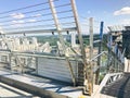 Large metal chrome shiny stairs with railings on the roof of a glass skyscraper, a tall building with a panoramic view Royalty Free Stock Photo