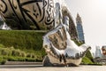 Large metal hand showing V - Victory near the Museum of The Future in Dubai city, United Arab Emirates