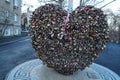 A large metal heart, on which there are many padlocks, symbols of love. Corner of old Odessa.