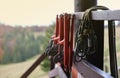 large metal locking carabiners with rope, climbing gear hanging on the store room. Height safety harness and arborist Royalty Free Stock Photo