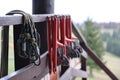 large metal locking carabiners with rope, climbing gear hanging on the store room. Height safety harness and arborist Royalty Free Stock Photo