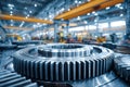 Large metallic gear with sharp teeth inside a well-lit industrial factory showcasing precision engineering and advanced Royalty Free Stock Photo