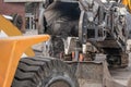 Large milling machine removing an old pavement layers at full depth