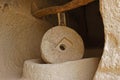 Large millstone in cave, Zelve Valley, Cappadocia, Turkey