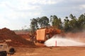 Large mine vehicle on red road near Weipa FNQ Australia