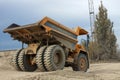 Large mining dump truck. Transport industry. Extraction of stone in an open pit