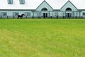 Large modern barn with a horse Royalty Free Stock Photo