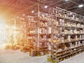 Large modern blurred warehouse industrial and logistics companies. Warehousing on the floor and called the high shelves