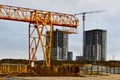 A large modern construction site in the construction of buildings and houses with appliances and many large high tower Royalty Free Stock Photo