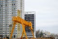 A large modern construction site in the construction of buildings and houses with appliances and many large high tower Royalty Free Stock Photo