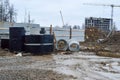 A large modern construction site in the construction of buildings and houses with appliances and many large high tower and Royalty Free Stock Photo