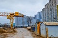 A large modern construction site in the construction of buildings and houses with appliances and many large high tower Royalty Free Stock Photo