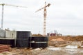 A large modern construction site in the construction of buildings and houses with appliances and many large high tower Royalty Free Stock Photo