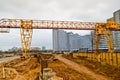 A large modern construction site in the construction of buildings and houses with appliances and many large high tower Royalty Free Stock Photo