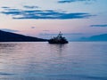 Modern Luxury Motor Cruiser Boat Anchored in Bay at Dawn, Greece