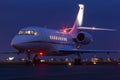 Large modern private business jet ready to take off at night Royalty Free Stock Photo