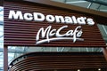 large modern signboard, McDonald\'s logo in lobby of airport, beautiful geometric background, three-dimensional letters