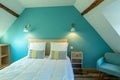 Large modern turquoise atic bedroom in Bed and breakfast guest room