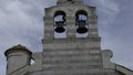 Large monuments standing next to the sea.Creative.A large stone tower and bell tower standing next to the sea with a Royalty Free Stock Photo