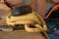 Large mooring bollard with ropes or hawsers Royalty Free Stock Photo
