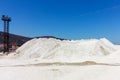 large mound of crushed stone limestone against the blue sky