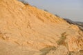 Large mountains of yellow sand.