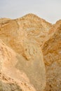 Large mountains of yellow sand.