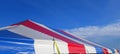 a long stripe red white and blue events or entertainment tent