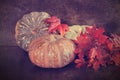 Large multi color pumpkins with autumn leaves