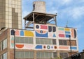 Large mural that wraps around a renovated building at 2200 Main Street in Dallas, Texas.