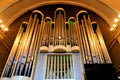 Large musical organ with organ pipes in Christian church. Musical instrument, Church service, concert