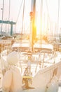 Large New Beautiful Yacht Moored in Dock at Mediterranean Sea. Front View of Boat Bow Nose. Tall Mast in Bright Golden Sunlight Royalty Free Stock Photo