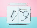 A large notebook for notes and drafting with stationery objects for a student on a pastel background. Ruler, marker, pencil Royalty Free Stock Photo