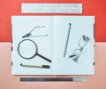 A large notebook for notes and drafting with stationery objects for a student. Ruler, marker, pencil, magnifying glass, compasses. Royalty Free Stock Photo