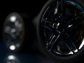 a large number of auto wheels with chrome rims.