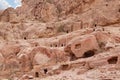 A large number of burial caves dug into rocks by Nabateans in the Nabatean Kingdom of Petra in the Wadi Musa city in Jordan Royalty Free Stock Photo