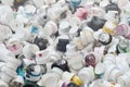 A large number of caps from cans of aerosol paint for graffiti. Smeared with colored paint nozzles lie in a huge pile Royalty Free Stock Photo