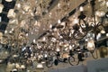 A large number of ceiling lamps, chandeliers in the store.