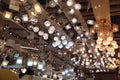 A large number of ceiling lamps, chandeliers in the store. Royalty Free Stock Photo