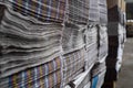 A large number of the issued newspapers in the printing house shop. A heap of multi-colored newspapers lie the friend on the Royalty Free Stock Photo