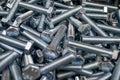 Large number of metal, steel bolts. Close-up. Macro. Background and texture Royalty Free Stock Photo