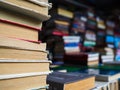 A large number of old books stacked on top of each other. Books for the study of different literature Royalty Free Stock Photo